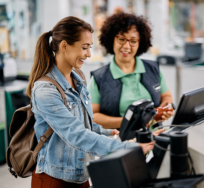 Customer Making Contactless Payment For Shopping At Checkout Of Grocery Store Using Mobile Phone
